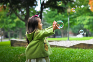child-playing-with-bubbles